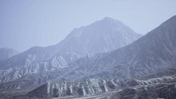 View of the Afghan mountains in fog photo