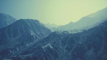 View of the Afghan mountains in fog photo