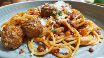 Close up photo of spaghetti and meatballs serve at the plate.