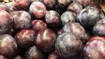 Pile of Syzygium cumini or java plum or black plum display at the market. photo