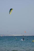 windsurfing, kitesurfing, water and wind sports powered by sails or kites photo