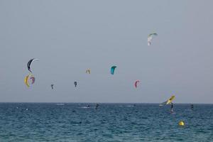 windsurfing, kitesurfing, water and wind sports powered by sails or kites photo