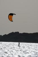 windsurfing, kitesurfing, water and wind sports powered by sails or kites photo