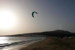 windsurfing, kitesurfing, water and wind sports powered by sails or kites photo