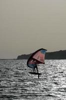 windsurfing, kitesurfing, water and wind sports powered by sails or kites photo