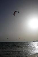 windsurfing, kitesurfing, water and wind sports powered by sails or kites photo