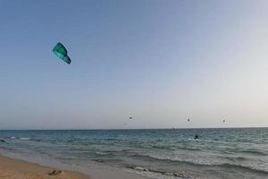 windsurfing, kitesurfing, water and wind sports powered by sails or kites photo