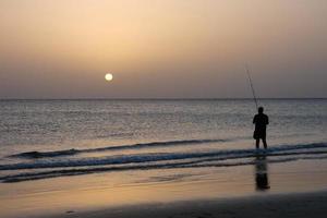 Beach shore fishing, traditional fishing as a hobby photo