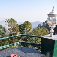 Early morning view of Modern rooftop restaurant at Kasauli, Himachal Pradesh in India, View of mountain hills from open air restaurant in Kasauli, Kasauli Rooftop restaurant photo