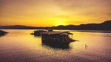 Aerial view of landscape sunset with Reservoir and raft house Thailand photo