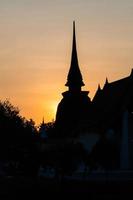 silhouette of Wat Temple beautiful temple in the historical park Thailand photo