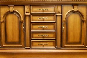 Wooden chest of drawers in the bedroom photo