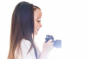 Girl hands holding camera with vintage color effect white background copy space photo