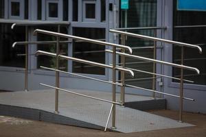 Shiny chrome metal fencing and railings yacht on the background of the smooth photo