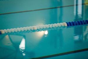 The view of an empty public swimming pool indoors lanes of a competition swimming pool sport photo