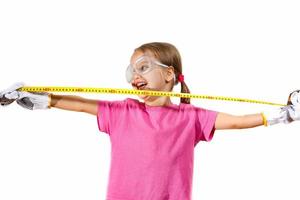 Little girl holding a meter isolated on white background the concept of development of the child photo