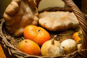 Pumpkin and autumn leaves on a old wooden table photo