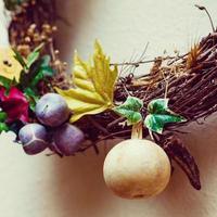 decorative wreath from a vine with dry plants photo