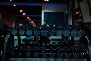 Rows of dumbbells in the gym photo