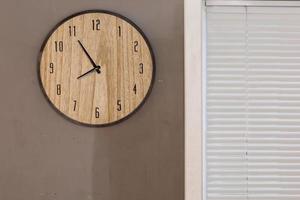 Five minutes to eight o clock on the dial round wall clock photo