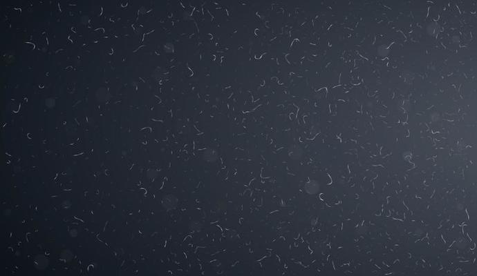 Macro dust particles flying over dark background.