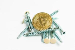 Gears and cogs close up and bitcoin coin white photo