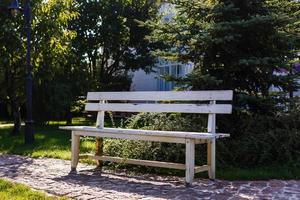 Wooden bench in the park photo