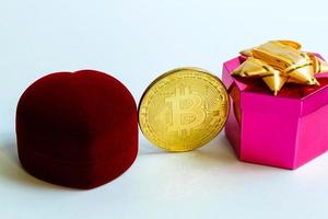 Coin bitcoin in a gift box for a ring or jewelry the concept of crypto currency the best gift photo