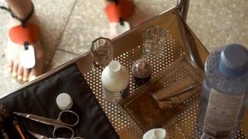 makeup artist mixes in a jar of Brown paint for eyebrows video