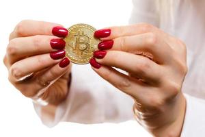 Golden bitcoin in a hands tug of war concept for business rivalry digitall symbol of a new photo