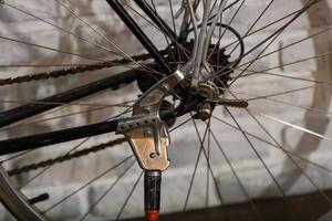 A bicycle chain is a roller chain that transfers power from the pedals to the drive wheel photo