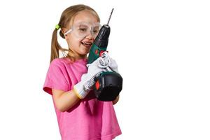 Little smiling girl holding a drill photo