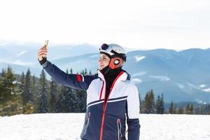 Girl skiing in the mountains photo