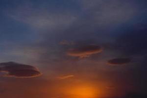 three clouds in the colorful sky photo