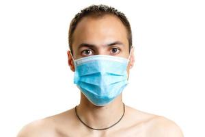 Stop the infection healthy man showing gesture stop of man wear protective mask against photo