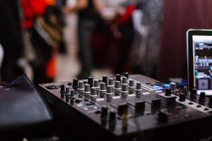 Close up of music controls buttons of studio mixer photo