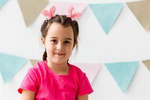 little girl in children's party in decorated room photo