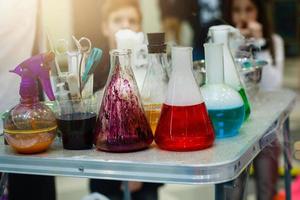 colored reagents in laboratory flasks photo