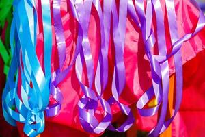 Multicolored ribbons on holiday as an abstract background photo