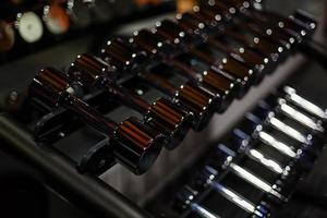 Rows of dumbbells in the gym photo