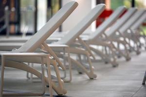 Empty pool with sun loungers photo