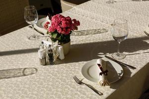 Served table with glasses in restaurant. photo