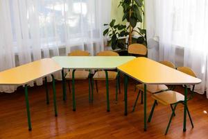 School desks are in a semicircle photo