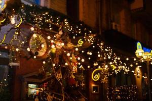 Garlands of lamps on a wooden stand on the street. A wedding Banquet. photo