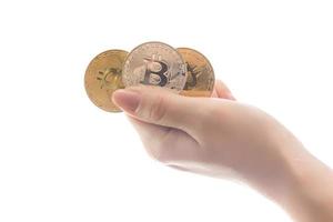 hand holds three coins of digital currency bitcoin photo