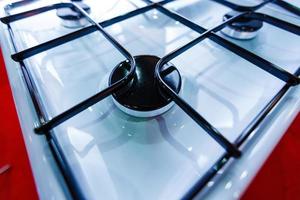 Dirty gas stove burners in kitchen room, close-up shooting. photo