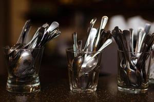 restaurant tableware, spoons and glass photo