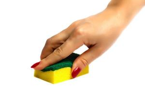 Woman hand holding a cleaning sponge isolated on a white background photo