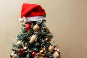 Christmas tree in Santa Claus hat photo