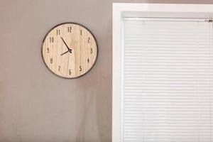 Five minutes to eight o clock on the dial round wall clock photo